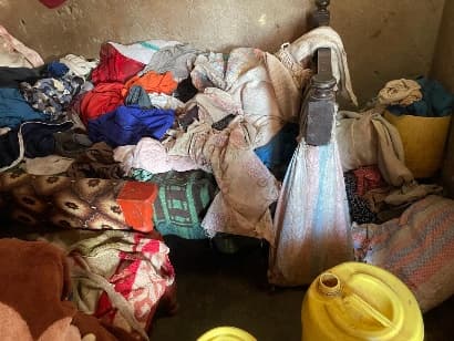 Donated clothing and blankets prepared for families in need